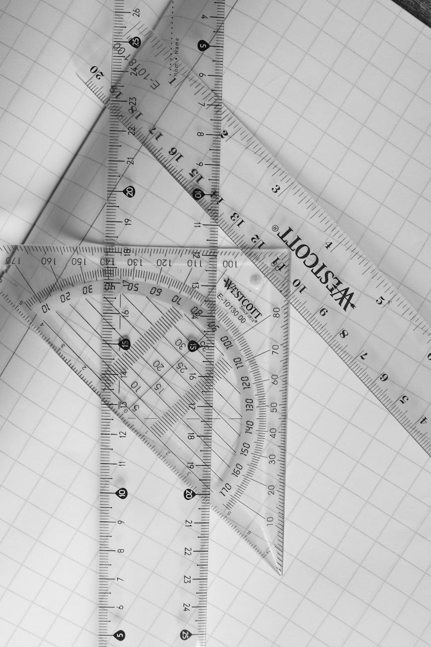 black and white geometric rulers on grid paper
