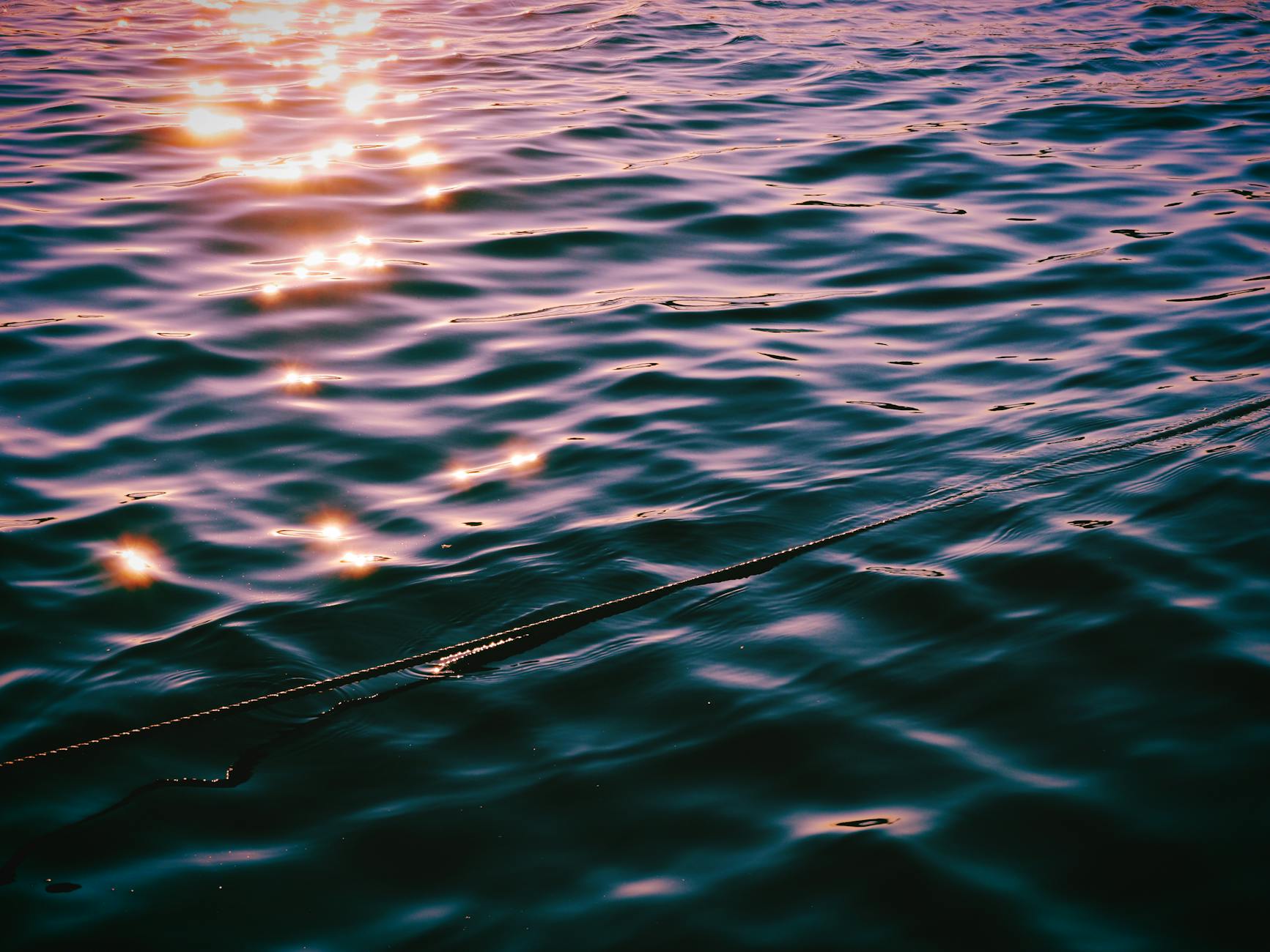 sunset reflections on water surface in stockholm