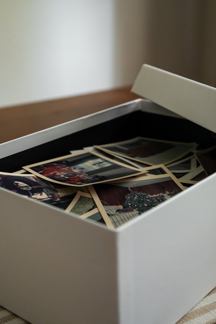collection of vintage family photographs in box